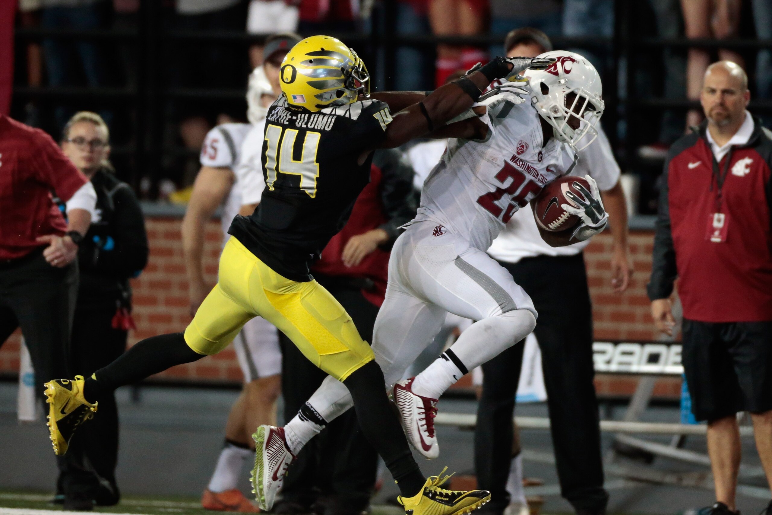 PULLMAN, WA - SEPTEMBER 20:  Jamal Morrow #25 of the Washington State Cougars is pushed out of bounds by Ifo Ekpre-Olomu #14 of the Oregon Ducks during the game at Martin Stadium on September 20, 2014 in Pullman, Washington.  Oregon defeated Washington State 38-31.  (Photo by William Mancebo/Getty Images)