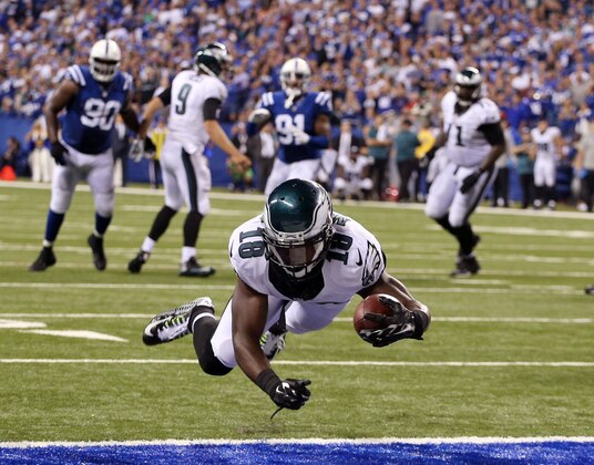 Sep 15, 2014; Indianapolis, IN, USA; Philadelphia Eagles wide receiver Jeremy Maclin (18) dives in to score the tying touchdown against the Indianapolis Colts at Lucas Oil Stadium. Philadelphia defeats Indianapolis 30-27. Mandatory Credit: Brian Spurlock-USA TODAY Sports