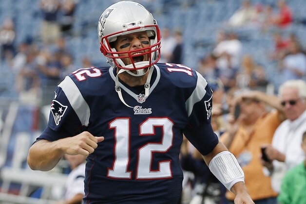 New England Patriots quarterback Tom Brady gets pumped up as he runs onto the field before an NFL football game against the Oakland Raiders Sunday, Sept. 21, 2014, in Foxborough, Mass. (AP Photo/Elise Amendola)