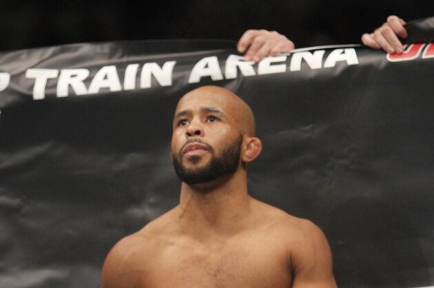 Defending Champion Demetrious Johnson warms up before fighting Joseph Benavidez  for the UFC Flyweight Mixed Martial Arts title in Sacramento, Calif., on Saturday, Dec. 14, 2013.(AP Photo/Steve Yeater)