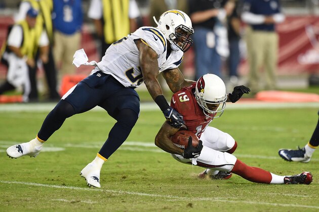 GLENDALE, AZ - SEPTEMBER 08: Wide receiver Ted Ginn #19 of the Arizona Cardinals is tackled by inside linebacker Manti Te'o #50 of the San Diego Chargers in the third quarter of the NBFL game at University of Phoenix Stadium on September 8, 2014 in Glendale, Arizona.  (Photo by Norm Hall/Getty Images)