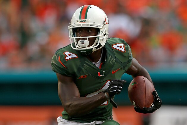 MIAMI, FL - SEPTEMBER 13: Phillip Dorsett #4 of the Miami Hurricanes rushes during a game against the Arkansas State Red Wolves at Sunlife Stadium on September 13, 2014 in Miami, Florida.  (Photo by Mike Ehrmann/Getty Images)