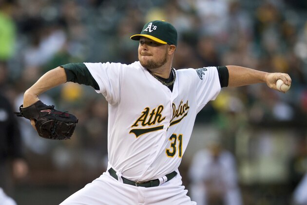 OAKLAND, CA - SEPTEMBER 19:  Jon Lester #31 of the Oakland Athletics pitches against the Philadelphia Phillies during the first inning of an interleague game at O.co Coliseum on September 19, 2014 in Oakland, California. (Photo by Jason O. Watson/Getty Images)