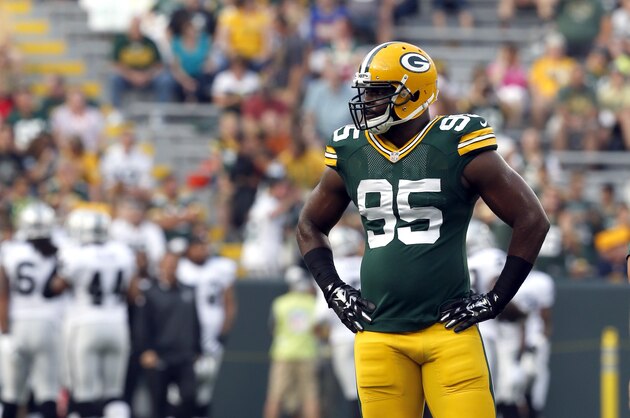 Green Bay Packers defensive end Datone Jones (95) takes a break before an NFL preseason football game against the Oakland Raiders Friday, Aug. 22, 2014, in Green Bay, Wis. (AP Photo/Mike Roemer)