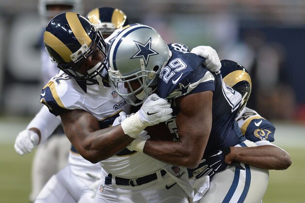 ST. LOUIS, MO - SEPTEMBER 21: Alec Ogletree #52 of the St. Louis Rams tackles DeMarco Murray #29 of the Dallas Cowboys in the second quarter at the Edward Jones Dome on September 21, 2014 in St. Louis, Missouri.  (Photo by Michael B. Thomas/Getty Images)
