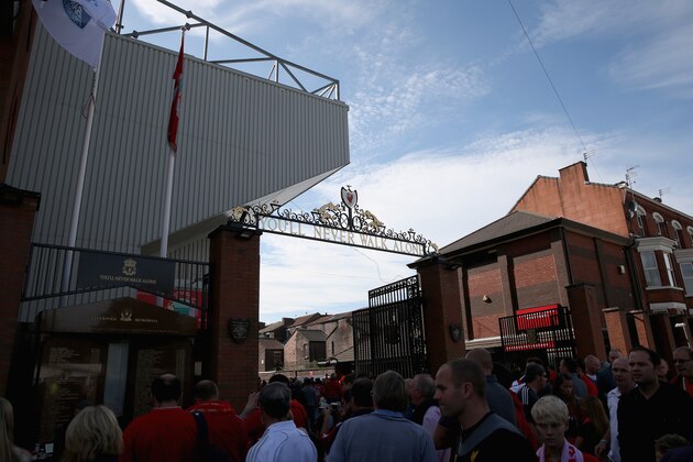 LIVERPOOL, ENGLAND - SEPTEMBER 21:  Liverpool fans stand outside the Shankly Gates prior to the Barclays Premier League match between Liverpool and Southampton at Anfield on September 21, 2013 in Liverpool, England.  (Photo by Clive Brunskill/Getty Images)