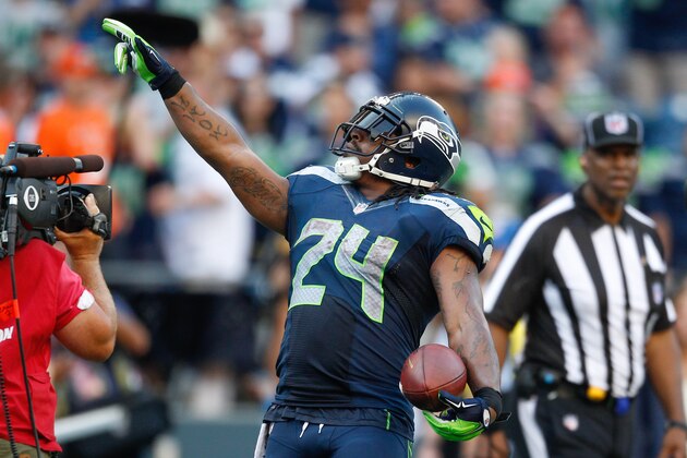 SEATTLE, WA - SEPTEMBER 21:  Running back Marshawn Lynch #24 of the Seattle Seahawks celebrates after rushing for the winning touchdown in overtime against the Denver Broncos at CenturyLink Field on September 21, 2014 in Seattle, Washington. The Seahawks defeated the Broncos 26-20.  (Photo by Otto Greule Jr/Getty Images)