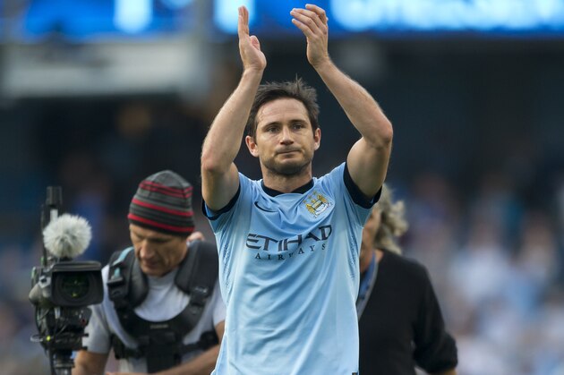 Manchester City's Frank Lampard applauds supporters after his team's 1-1 draw against Chelsea during their English Premier League soccer match at the Etihad Stadium, Manchester, England, Sunday Sept. 21, 2014. Lampard scored the equalizing goal after an opening goal by Chelsea's Andre Schurrle. (AP Photo/Jon Super)