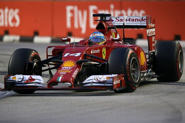 Ferrari driver Fernando Alonso of Spain steers his car during the third practice session of the Singapore Formula One Grand Prix on the Marina Bay City Circuit in Singapore, Saturday, Sept. 20, 2014. (AP Photo/Aaron Favila)