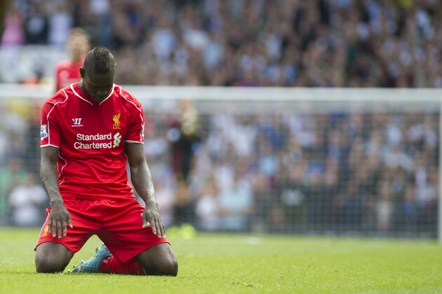 Liverpool's Mario Balotelli reacts after missing a chance to score against Tottenham Hotspur, during their English Premier League soccer match at White Hart Lane, London, Sunday, Aug. 31, 2014 (AP Photo/Bogdan Maran)