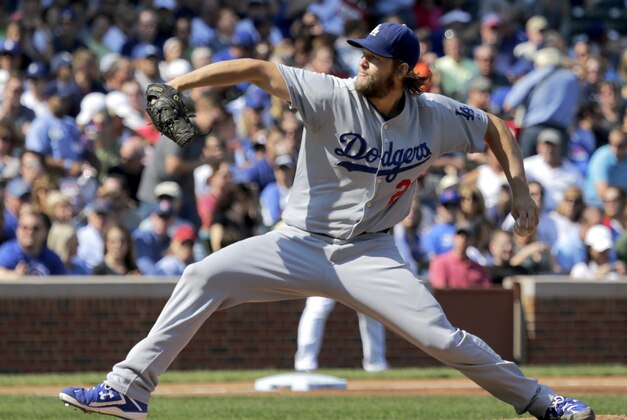 Los Angeles Dodgers starting pitcher Clayton Kershaw delivers during the first inning of a baseball game against the Chicago Cubs, Friday, Sept. 19, 2014, in Chicago. (AP Photo/Charles Rex Arbogast)
