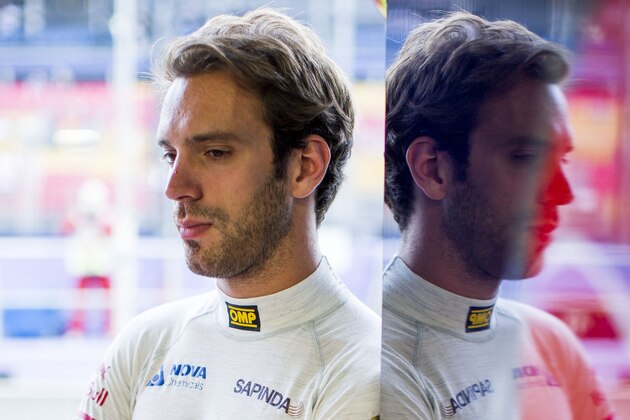 SINGAPORE - SEPTEMBER 20:  Jean-Eric Vergne of Toro Rosso and France ahead of the Singapore F1 Grand Prix at Marina Bay Street Circuit on September 20, 2014 in Singapore.  (Photo by Peter Fox/Getty Images)