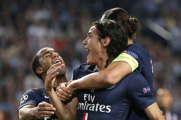 PSG's Edinson Cavani, center, reacts after scoring the opening goal, with PSG's Zlatan Ibrahimovic, right, and PSG's Lucas during the Group F Champions League match between Ajax and Paris Saint-Germain at ArenA stadium in Amsterdam, Netherlands, Wednesday, Sept. 17, 2014. (AP Photo/Peter Dejong)