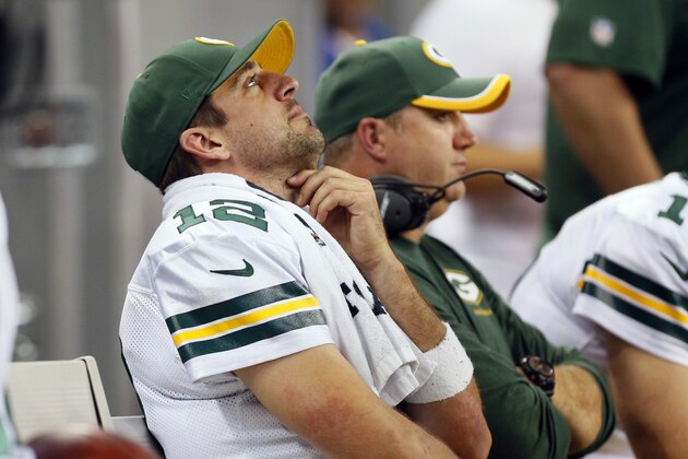Green Bay Packers quarterback Aaron Rodgers (12) is seen on the bench during the second half of an NFL football game against the Detroit Lions in Detroit, Sunday, Sept. 21, 2014. (AP Photo/Paul Sancya)