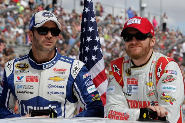 AVONDALE, AZ - MARCH 02:  Jimmie Johnson, driver of the #48 Lowe's Chevrolet, and Dale Earnhardt Jr., driver of the #88 National Guard Chevrolet, take part in pre-race ceremonies during the NASCAR Sprint Cup Series The Profit On CNBC 500 at Phoenix International Raceway on March 2, 2014 in Avondale, Arizona.  (Photo by Jerry Markland/Getty Images)