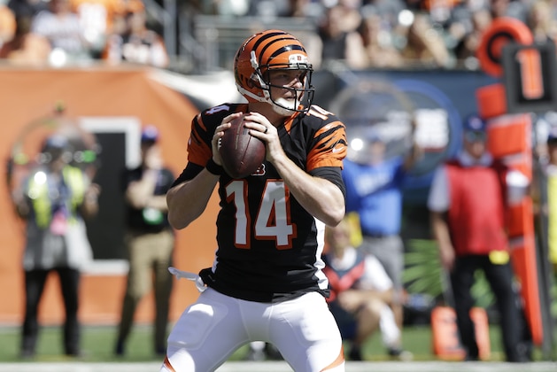 Cincinnati Bengals quarterback Andy Dalton passes against the Tennessee Titans in the first half of an NFL football game, Sunday, Sept. 21, 2014, in Cincinnati. (AP Photo/Al Behrman)