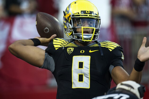 Oregon quarterback Marcus Mariota throws to a receiver during warmups before the start of an NCAA college football game against Washington State on Saturday, Sept. 20, 2014, at Martin Stadium in Pullman, Wash. Oregon won 38-31. (AP Photo/Dean Hare)