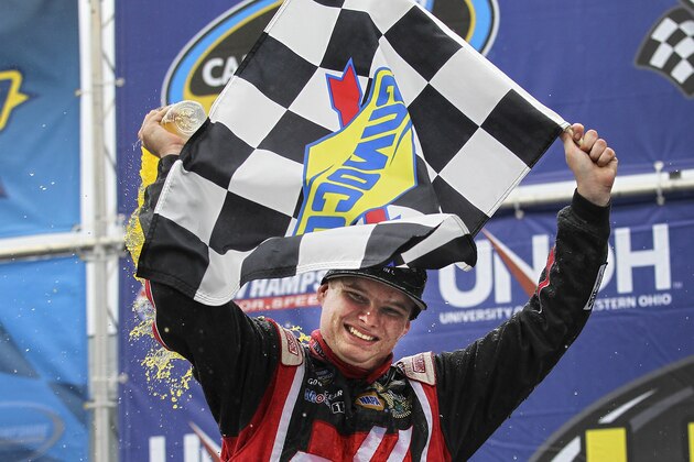 Driver Cole Custer celebrates in Victory Lane after winning the Camping World Truck Series at New Hampshire Motor Speedway, Loudon, N.H., Saturday, Sept. 20, 2014.  (AP Photo/Cheryl Senter)