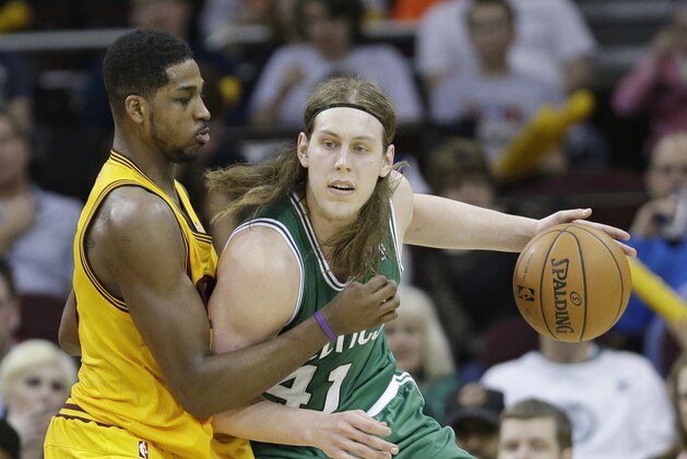 Boston Celtics' Kelly Olynyk, right, from Canada, drives past Cleveland Cavaliers' Tristan Thompson, from Canada, during the fourth quarter of an NBA basketball game Saturday, April 12, 2014, in Cleveland. Boston defeated Cleveland 111-99. (AP Photo/Tony Dejak)