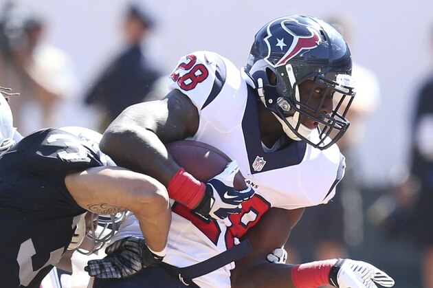 Houston Texans RB #28 Alfred Blue in action in the second quarter in a game against the Oakland Raiders at the O.co Coliseum at an NFL game in Oakland, Calif. on Sunday Sept. 14, 2014. (AP Photo/David Seelig)