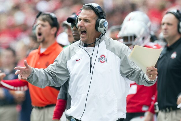 Sep 13, 2014; Columbus, OH, USA; Ohio State Buckeyes head coach Urban Meyer reacts to a call by the officials in the game against the Kent State Golden Flashes at Ohio Stadium. Ohio State won the game 66-0. Mandatory Credit: Greg Bartram-USA TODAY Sports