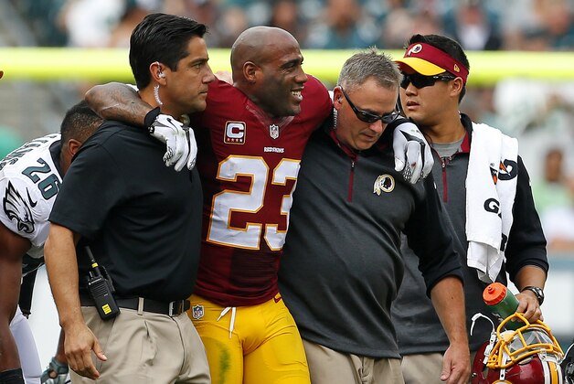 PHILADELPHIA, PA - SEPTEMBER 21:  DeAngelo Hall #23 of the Washington Redskins is helped off the field by medical personal during the third quarter of a game against the Philadelphia Eagles at Lincoln Financial Field on September 21, 2014 in Philadelphia, Pennsylvania.  (Photo by Rich Schultz/Getty Images)