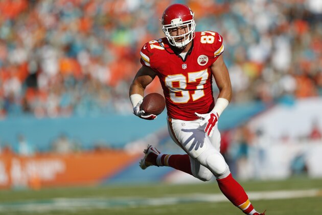 MIAMI GARDENS, FL - SEPTEMBER 21:  Tight end Travis Kelce #87 of the Kansas City Chiefs returns a turnover for a second-quarter touchdown against the Miami Dolphins during their game at Sun Life Stadium on September 21, 2014 in Miami Gardens, Florida.  (Photo by Joel Auerbach/Getty Images)
