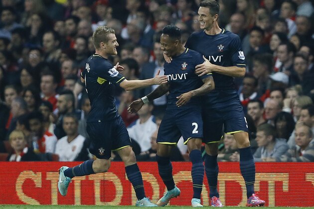 Southampton's Nathaniel Clyne, centre, celebrates scoring a goal during the English League Cup soccer match between Arsenal and Southampton at Emirates Stadium in London, Tuesday, Sept. 23, 2014. (AP Photo/Kirsty Wigglesworth)