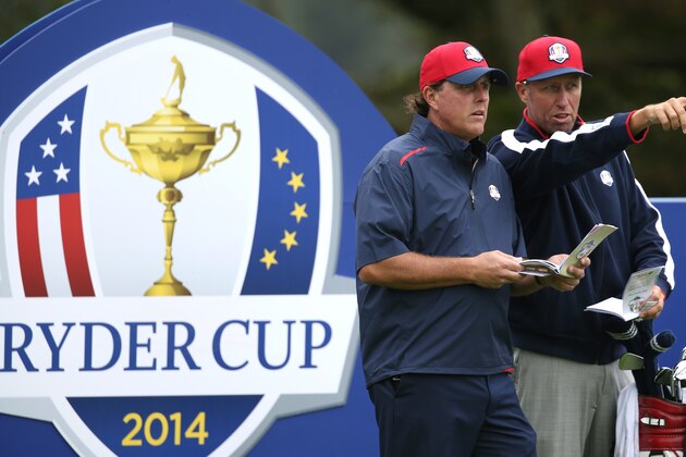 Phil Mickelson of the US looks along the 4th fairway from the tee box with his caddie during a practice round ahead of the Ryder Cup golf tournament at Gleneagles, Scotland, Tuesday, Sept. 23, 2014. (AP Photo/Peter Morrison)