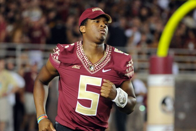 Sep 20, 2014; Tallahassee, FL, USA; Florida State Seminoles quarterback Jameis Winston (5) runs on to the field after halftime before the start of the second half of the game against the Clemson Tigers at Doak Campbell Stadium. Mandatory Credit: Melina Vastola-USA TODAY Sports