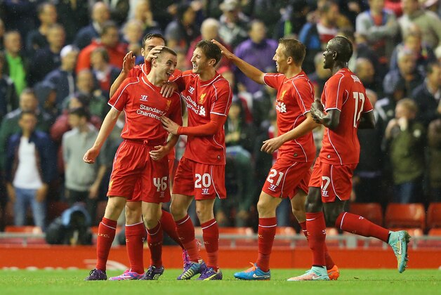 LIVERPOOL, ENGLAND - SEPTEMBER 23:  Jordan Rossiter of Liverpool celebrates with team mates after scoring the opening goal during the Capital One Cup Third Round match between Liverpool and Middlesbrough at Anfield on September 23, 2014 in Liverpool, England.  (Photo by Alex Livesey/Getty Images)