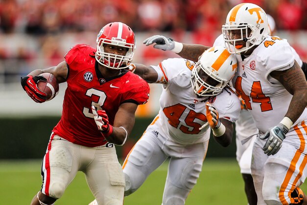 September 29, 2012; Athens, GA, USA; Georgia Bulldogs running back Todd Gurley (3) runs away from Tennessee Volunteers linebacker A.J. Johnson (45) in the second half at Sanford Stadium. The Bulldogs won 51-44. Mandatory Credit: Daniel Shirey-USA TODAY Sports