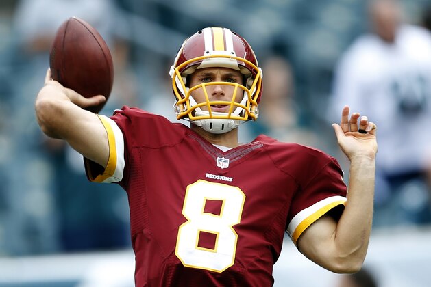 Washington Redskins quarterback Kirk Cousins warms up prior to an NFL football game against the Philadelphia Eagles, Sunday, Sept. 21, 2014, in Philadelphia. (AP Photo/Michael Perez)