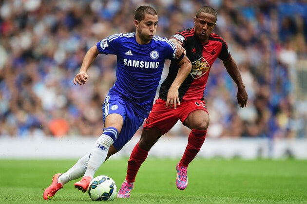 LONDON, ENGLAND - SEPTEMBER 13:  Eden Hazard of Chelsea takes on Wayne Routledge of Swansea City during the Barclays Premier League match between Chelsea and Swansea City at Stamford Bridge on September 13, 2014 in London, England.  (Photo by Jamie McDonald/Getty Images)