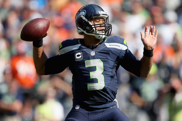 SEATTLE, WA - SEPTEMBER 21:  Quarterback Russell Wilson #3 of the Seattle Seahawks drops back to pass in the second quarter against the Denver Broncos at CenturyLink Field on September 21, 2014 in Seattle, Washington.  (Photo by Jeff Gross/Getty Images)