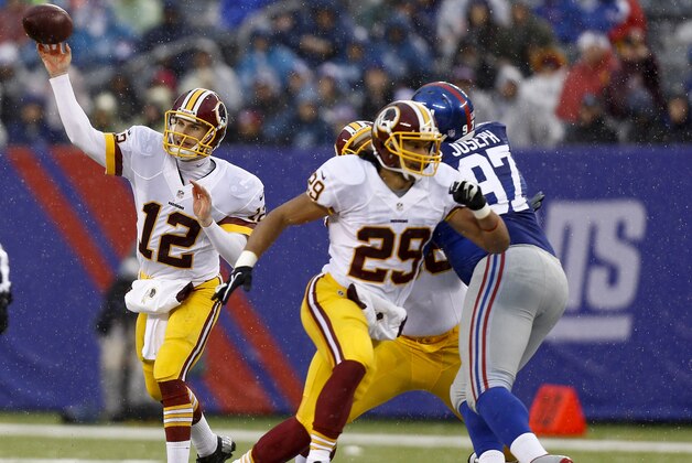 EAST RUTHERFORD, NJ - DECEMBER 29:   Kirk Cousins #12 of the Washington Redskins passes during their game against the New York Giants at MetLife Stadium on December 29, 2013 in East Rutherford, New Jersey.  (Photo by Jeff Zelevansky/Getty Images)