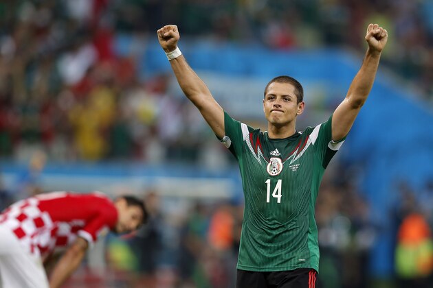 Mexico's Javier Hernandez celebrates at the end of  the group A World Cup soccer match between Croatia and Mexico at the Arena Pernambuco in Recife, Brazil, Monday, June 23, 2014. Mexico won 3-1. (AP Photo/Eduardo Verdugo)