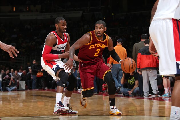 WASHINGTON, DC - FEBRUARY 7: Kyrie Irving #2 of the Cleveland Cavaliers drives against John Wall #2 of the Washington Wizards during the game at the Verizon Center on February 7, 2014 in Washington, DC. NOTE TO USER: User expressly acknowledges and agrees that, by downloading and or using this photograph, User is consenting to the terms and conditions of the Getty Images License Agreement. Mandatory Copyright Notice: Copyright 2014 NBAE (Photo by Ned Dishman/NBAE via Getty Images)