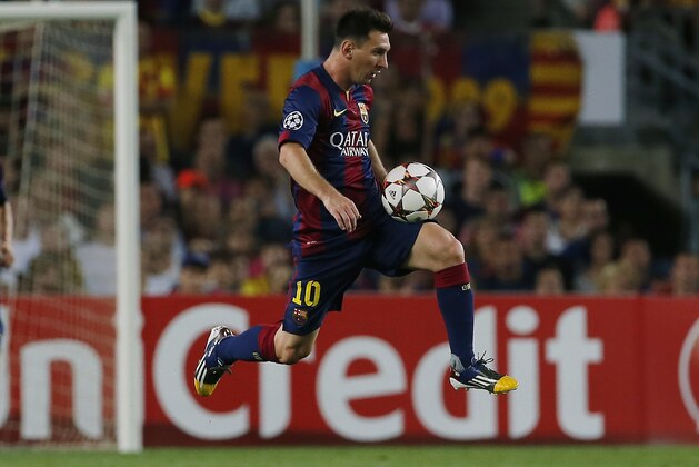 Barcelona's Lionel Messi controls the ball during the Champions League Group F soccer match between Barcelona and Apoel at the Camp Nou stadium in Barcelona, Spain, Wednesday, Sept. 17, 2014. (AP Photo/Emilio Morenatti)