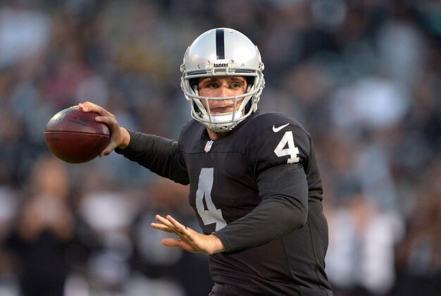 oAug 28, 2014; Oakland, CA, USA; Oakland Raiders quarterback Derek Carr (4) throws a pass against the Seattle Seahawks at O.co Coliseum. Mandatory Credit: Kirby Lee-USA TODAY Sports