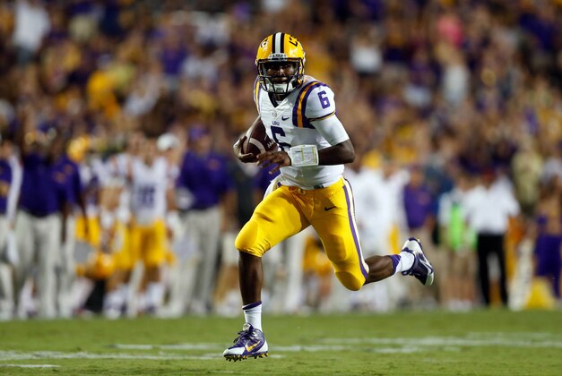 Sep 6, 2014; Baton Rouge, LA, USA; LSU Tigers quarterback Brandon Harris (6) runs for a touchdown against the Sam Houston State Bearkats during the first half of a game at Tiger Stadium. Mandatory Credit: Derick E. Hingle-USA TODAY Sports