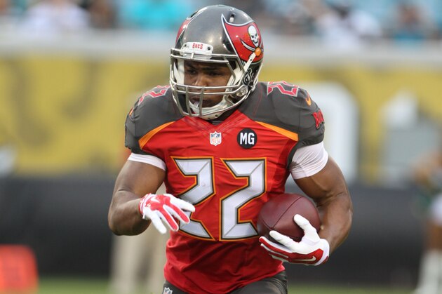 Running back Doug Martin #22 of the Tampa Bay Buccaneers runs the ball during a Pre-Season NFL football game against the Jacksonville Jaguars, Friday, Aug. 8, 2014, in Jacksonville, Fla. (Photo by Marc Serota/Panini/AP Images)