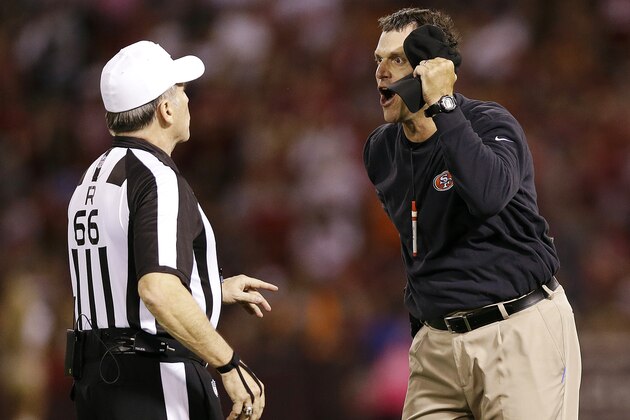 ADVANCE FOR WEEKEND EDITIONS, NOV. 17-18 - FILE - This Oct. 18, 2012 file photo shows San Francisco 49ers head coach Jim Harbaugh, right, reacting as he talks with referee Walt Anderson (66) during the second half of an NFL football game against the Seattle Seahawks in San Francisco. The replacement officials are gone but the regulars have had their share of issues this season in a sport that becomes ever more difficult to officiate.  (AP Photo/Marcio Jose Sanchez, File)