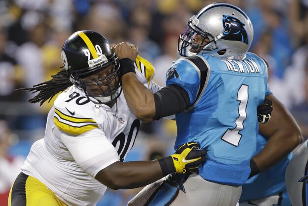 Carolina Panthers' Cam Newton (1) is sacked by Pittsburgh Steelers' Steve McLendon (90) during the first half of an NFL football game in Charlotte, N.C., Sunday, Sept. 21, 2014. (AP Photo/Bob Leverone)
