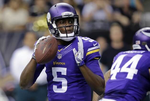 Minnesota Vikings quarterback Teddy Bridgewater (5) drops back to pass in the first half of an NFL football game against the New Orleans Saints in New Orleans, Sunday, Sept. 21, 2014. (AP Photo/Bill Haber)