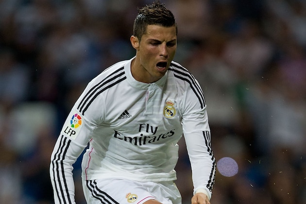 MADRID, SPAIN - SEPTEMBER 23:  Cristiano Ronaldo of Real Madrid CF celebrates scoring their second goal from a penalty shot during the La Liga match between Real Madrid CF and Elche CF at Estadio Santiago Bernabeu on September 23, 2014 in Madrid, Spain.  (Photo by Gonzalo Arroyo Moreno/Getty Images)