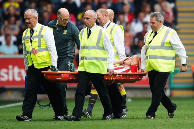 SWANSEA, WALES - SEPTEMBER 20:  James Ward-Prowse of Southampton is stretchered off during the Barclays Premier League match between Swansea City and Southampton at Liberty Stadium on September 20, 2014 in Swansea, Wales.  (Photo by Steve Bardens/Getty Images)