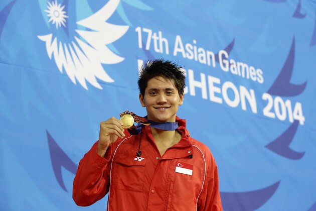 INCHEON, SOUTH KOREA - SEPTEMBER 24:  Joseph Schooling of Singapore wins the gold medal in the menÕs 100m butterfly final  on day five of 2014 Asian Games at Munhak Park Tae-hwan Aquatics Center on September 23, 2014 in Incheon, South Korea.  (Photo by Suhaimi Abdullah/Getty Images)