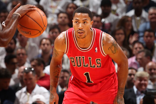 MIAMI, FL - OCTOBER 29: Derrick Rose #1 of the Chicago Bulls defends against the Miami Heat on October 29, 2013 at AmericanAirlines Arena in Miami, Florida. NOTE TO USER: User expressly acknowledges and agrees that, by downloading and or using this photograph, User is consenting to the terms and conditions of the Getty Images License Agreement. Mandatory Copyright Notice: Copyright 2013 NBAE (Photo by Joe Murphy/NBAE via Getty Images)
