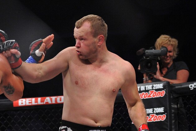 May 17, 2014; Southaven, MS, USA; Alexander Shlemnko (red gloves) fights against  Tito Ortiz (blue gloves) during BFC 120 at Landers Center. Mandatory Credit: Justin Ford-USA TODAY Sports
